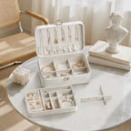 2-layer lockable jewelry box with removable dividers showing necklace area, ring zone, 6-grid base and detachable partition tray