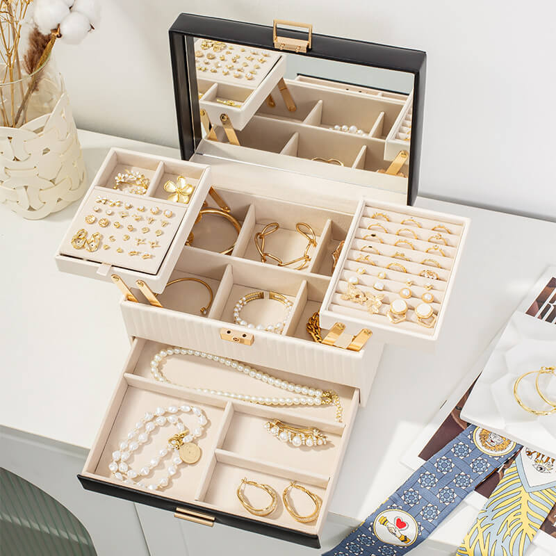 3-layer jewelry box open showing mirror lid, foldable top tray, adjustable ring and earring compartments and bottom drawer