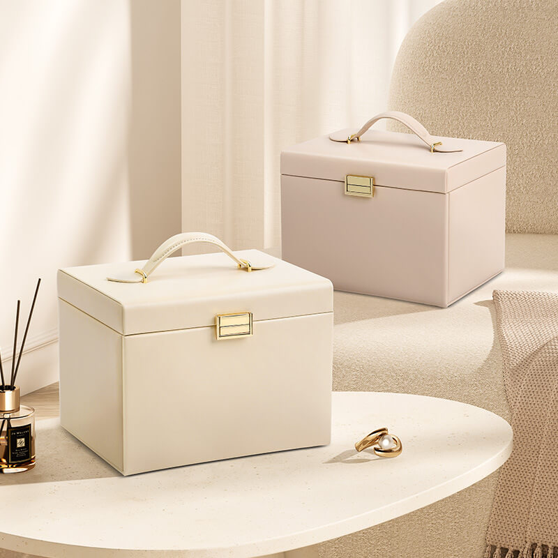 3-layer jewelry box in white and pink on vanity table, lifestyle scene