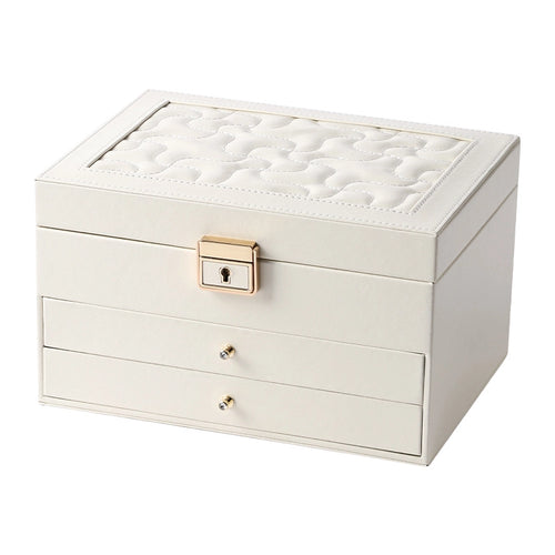 A clean studio shot of a cream-white 3-tier leather jewelry organizer box closed on a solid white background, highlighting its quilted lid texture and gold hardware.