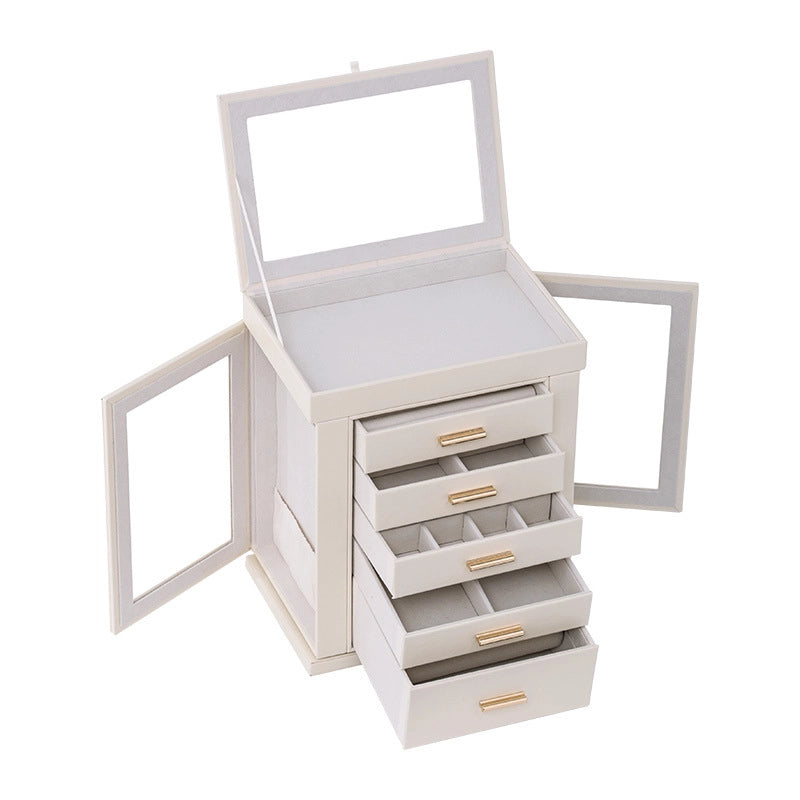 An empty cream-white jewelry box displayed on a white background with its top lid open, both side glass doors swung open, and five drawers pulled out in a tiered arrangement to showcase various internal dividers and storage layouts.
