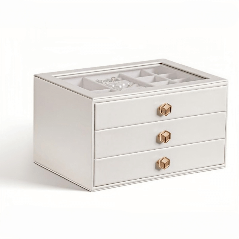 White 3-layer stackable jewelry box with glass lid on bedside table, lifestyle scene