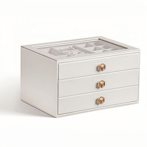 White 3-layer stackable jewelry box with glass lid on bedside table, lifestyle scene