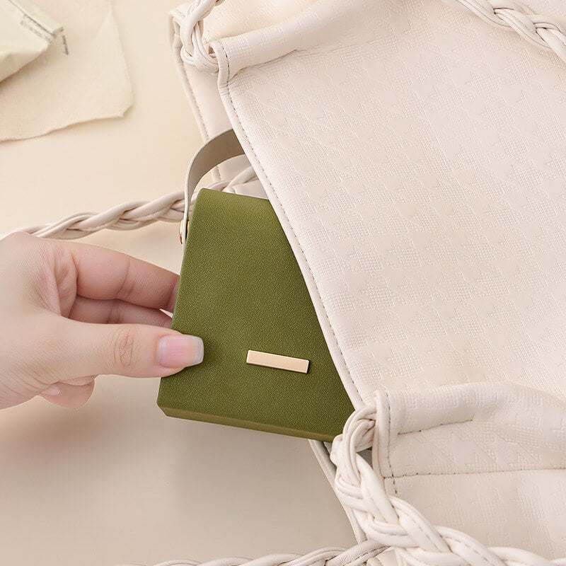 Mini travel jewelry box small enough to fit inside a handbag