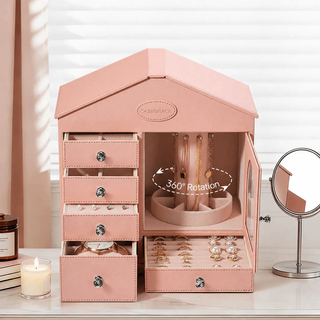 Pink house jewelry box fully open with 360-degree rotating necklace column on vanity