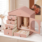 Pink house jewelry box open on dresser, lifestyle scene