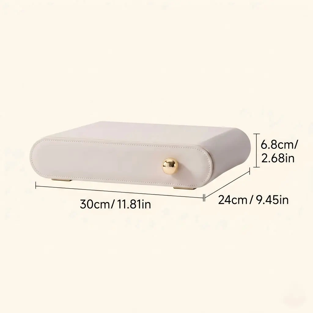 A cream white leather jewelry box with text showing product dimensions in both centimeters and inches.