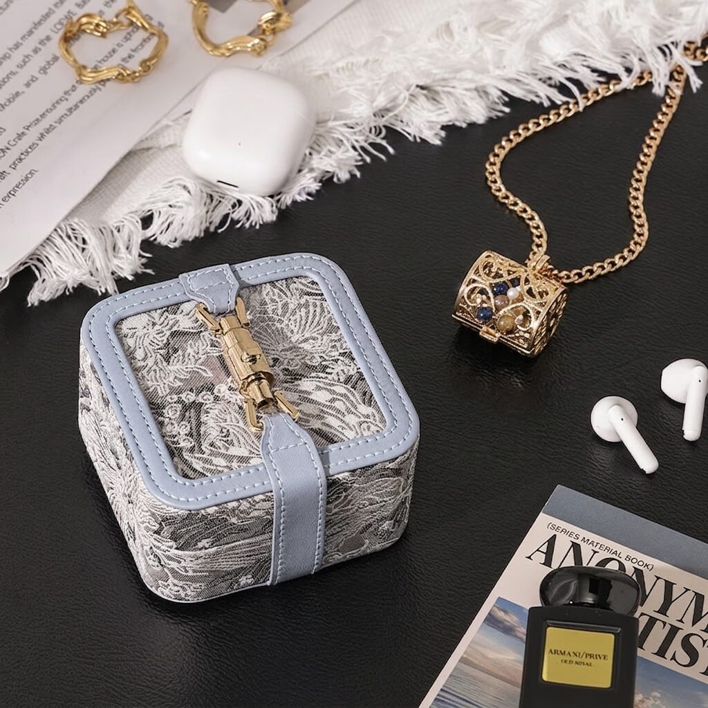 Mini 3D embroidered jacquard fabric lock clasp jewelry box with accessories, lifestyle scene