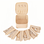 Mini travel jewelry box with 6 velvet zipper pockets displayed open alongside the box